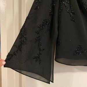 black flowy beaded blouse